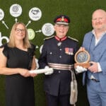 bio-d accepting the kings award enterprise